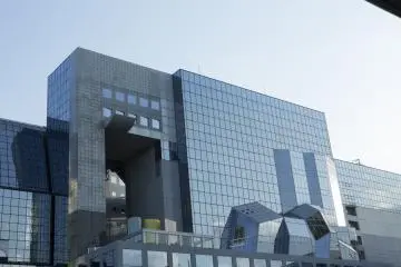 The glass front of the building distorts the reflection of the city in a way that I found reminiscent of cubism