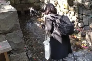 Ritual of throwing water on a rock