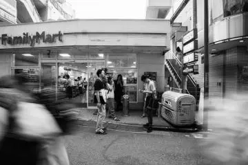 ...And more photos of people smoking outside of konbini. Konbini itself can be, or should be, considered its own subculture in Japan. Konbini, or convenient stores, fulfill their role of bringing convenience to people's lives. They are everywhere; they smell good; they open 24/7; and they play really good music. Every konbini has its own smoking area in front where one could see people of all ages smoke, eat, drink and chat with each other at literally any time of the day.