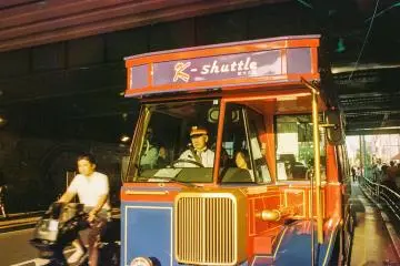 Here's the tourists' bright red bus in Shin-Okubo, or Korean Town, in Tokyo. It glowed under the beautiful, gentle, and golden sunset light.