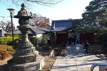 Stone lanterns amidst the open temple grounds
