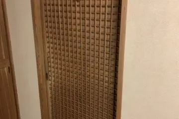 Even the bathroom door shows fancy woodwork