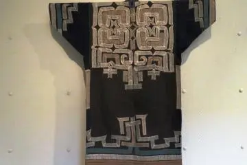 This Ainu robe is known as the Attu, which is made from the fibres of a Japanese elm tree. The Ainu hold these trees in high regard, seeing them as sources of wisdom. 