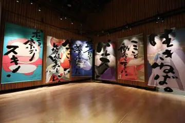 A display of Suzuki's calligraphy against the Ghibli films he produced  (Photo: <a href="https://suzukitoshio-ghibli.com/" target="_blank" rel="noreferrer noopener nofollow">Toshio Suzuki and Ghibli Exhibition</a>)