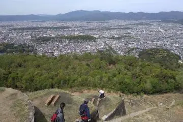 Part of stone character on mountain 