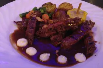 <p>The garlic New York strip sirloin steak comes with five large drops of horseradish sauce</p>