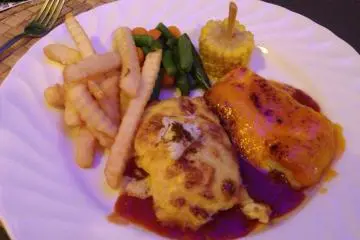 <p>Red Snapper is available in several dishes at Sam's; it's shown here baked with crustacean sauce and crab stuffing</p>