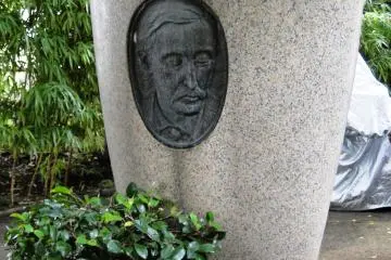 A plaque of the author in the garden