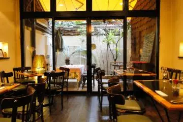 Interior of the restaurant, with a view of the terrace