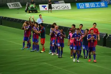F.C. Tokyo: Thanking the fans after the final whistle.