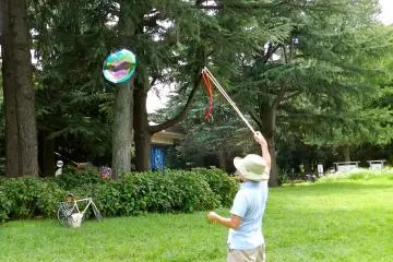 Like a magician with his (bubble) wand.