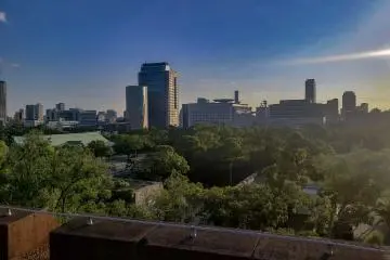 A modern metropolis, contrasting with the traditions of Osaka Castle 