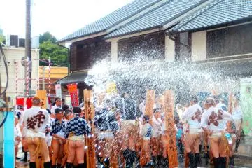 <p>Children participate as well, and people throw water towards the participants to cool them off and for purification</p>