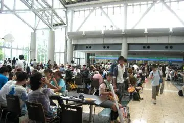 Cafe eating area, with convenience store in the background