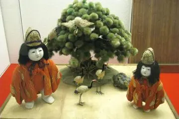 A pair of traditional dolls