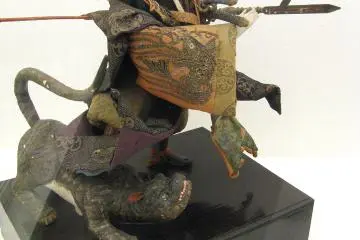 Halberd in hand, the kabuki-faced samurai doll