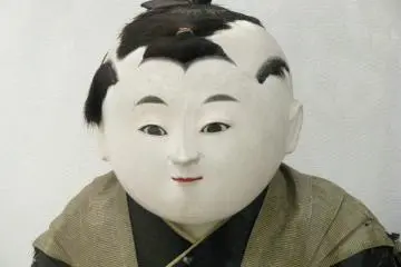 A doll with an amusing look to his face