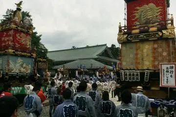The opening ceremony with elaborate floats and participants in colorful clothing