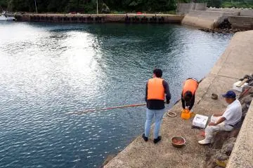 Going fishing with a local dad is a part of the homestay program.