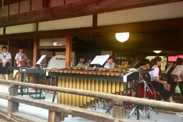 Members of the local middle school orchestra. The old town house receiving room is transformed into a stage.