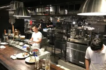 Chef Tamaki (pictured here) personally makes every pizza