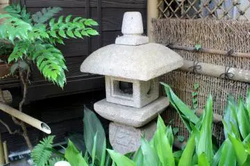 Beautiful stone lantern in a garden corner
