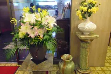 Vases made of natural stones and fresh flowers