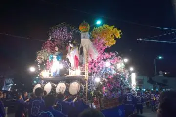 Live flames on a float at night
