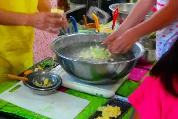 A girl making tempura