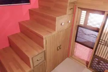 Stairs that lead to the top beds.