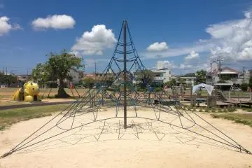 <p>There's a small assortment of children's playground equipment in the center of the park; this is an elongated spider web that children love to climb on</p>