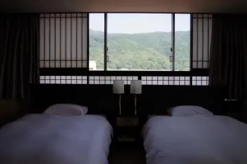 Two single beds in the Western part with paper windows