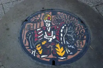 Manhole cover of Yakuoin priest performing fire ritual