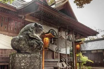 One of two Koma-inu (Guardian dogs), which look down intently at every visitor
