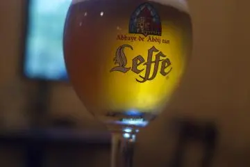 <p>Leffe on draft! Stained glass view behind</p>
