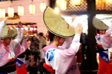 Traditional dancers in hats at the Hanagasa Matsuri