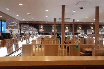 The easy interior of a modern sushi-train restaurant