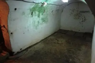 The spots on the walls are the aftermath of seppuku at the Former Japanese Navy Underground Headquarters
