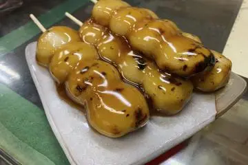 Delicious mitarashi dango (rice dumplings with a sweet sauce glaze) at Shiraishi Confectionery
