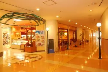 The hotel is connected to a commercial building
