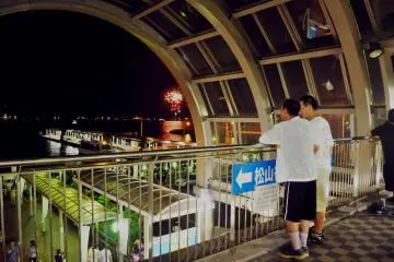 Some people decided to enjoy the show from the department store located in the back area of the port.