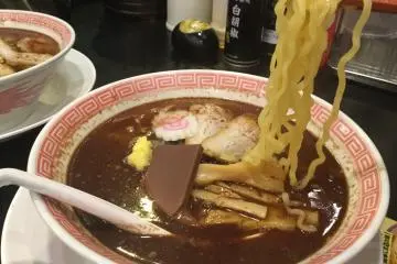 It really is ramen underneath. The base is shoyu (soy sauce) broth.