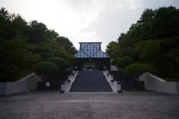 Pei designed the building to minimize the visual effect on the landscape. Its silhouette harmonizes with the mountains and, at first sight, it looks like a small house.