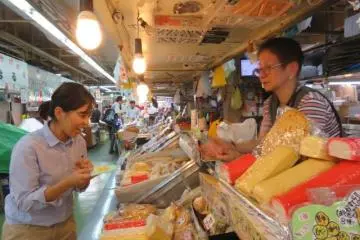 The narrow alleyways in the market allow us to have one on one conversations and discoveries with the owner of this fish cake stall.