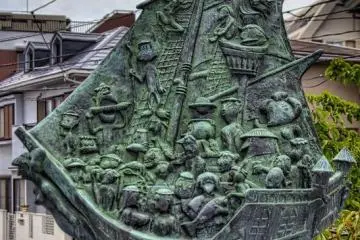 Bronze sculpture on one of the thirteen Ebi River bridges