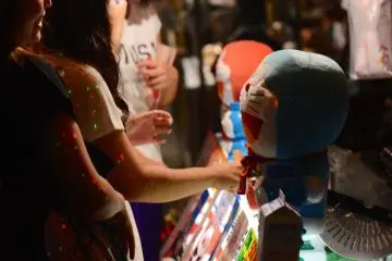 Teenage girls anticipating purchasing soft toys