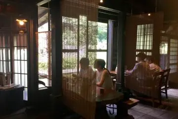 Bamboo dividers provide some privacy without sacrificing the grandeur of the house.