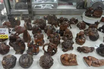 Originally made from ivory, these netsuke are miniature wooden carvings that long ago were designed to be attached to the end of money pouches, tobacco pouches, pillboxes, and (nowadays) cell phones,