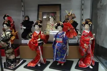 Female dolls feature kimono and traditional Japanese hairstyles, while male dolls sport samurai and ninja costumes.