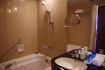 Bath and shower areas are separated in the executive rooms while the standard rooms have a shared bath and shower